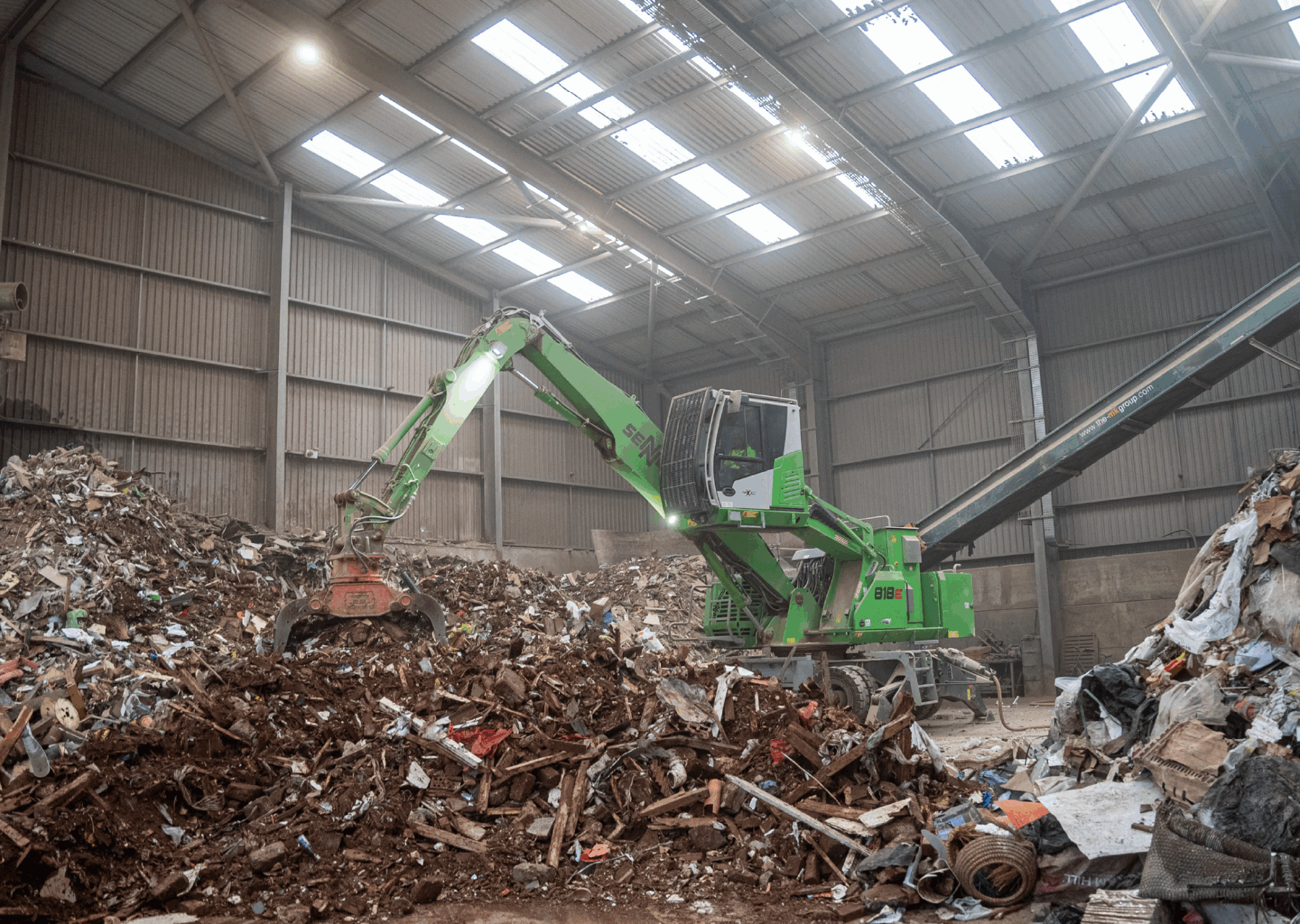 Sennebogen 818E material handlers from Molson cut both emissions and costs for EMS Waste Services as they process 150,000 tonnes of material per year